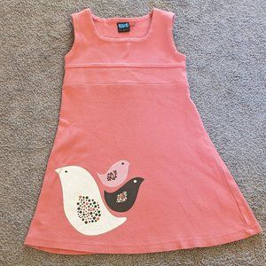 2T coral colored sleeveless dress with birds on the skirt.